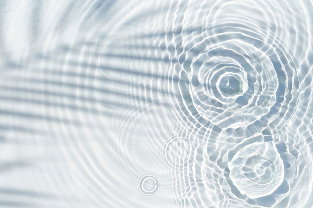 Water drops fall on the transparent surface